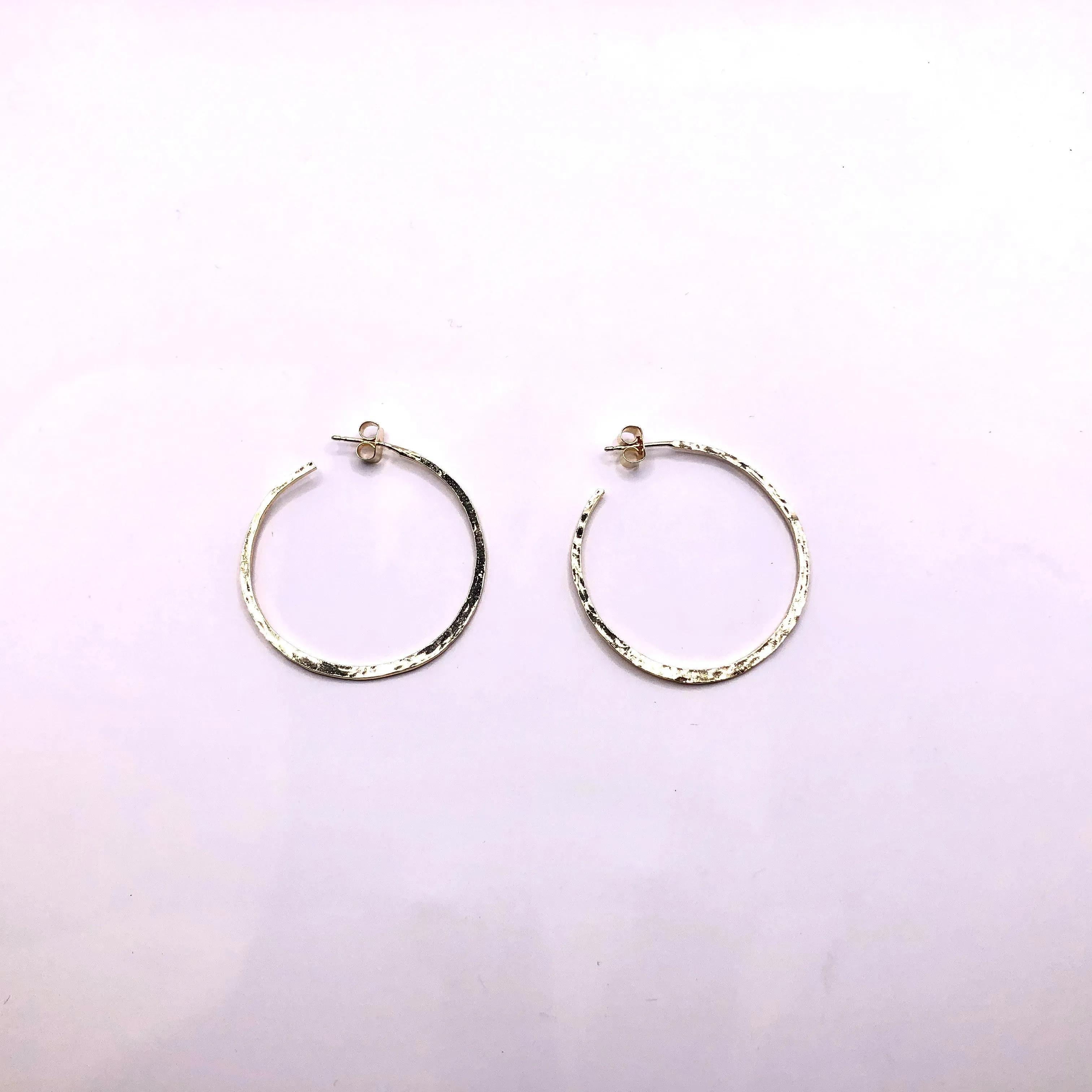 Open medium hammered silver/gold plated gypsy earrings.